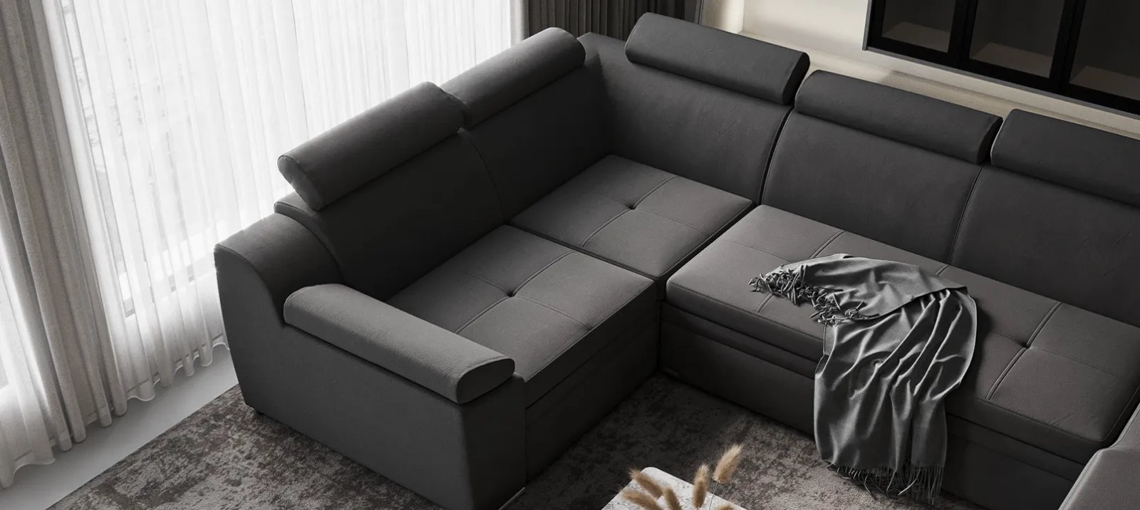 Nelson sofa lova kampu su gilia sėdyne ir plačiais žemais porankiais.