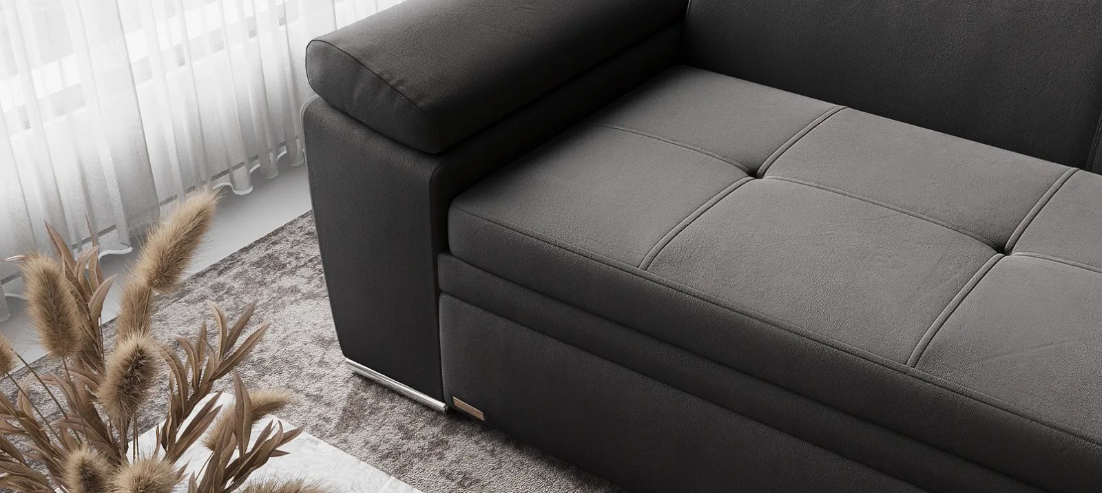 Nelson sofa lova iš šono su žemu korpusu ir plonomis tamsiomis kojelėmis.