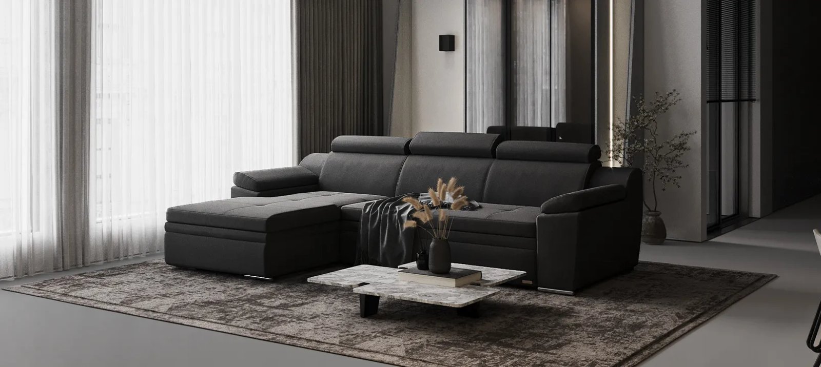 Pilka Nelson sofa lova svetainėje su žemu korpusu ir tamsiomis kojelėmis.