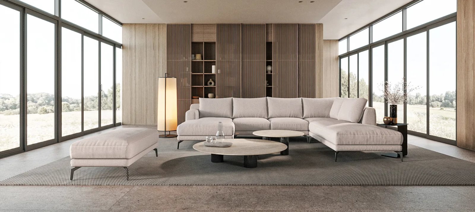 Sydney sofa kampu su giliomis sėdynėmis ir laisvai išdėstytomis nugaros pagalvėmis.