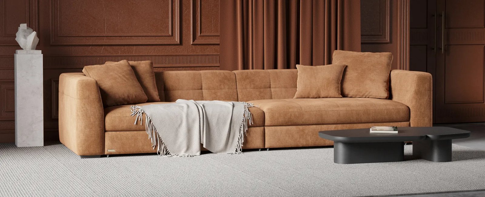 Dortmund kampinė sofa iš šono su žemu korpusu ir giliomis sėdynėmis.