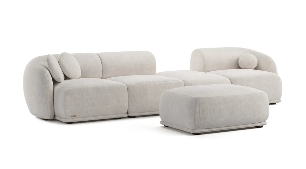 Kreminė Otis modulinė sofa su lenktais atlošais ir atskiru stačiakampiu minkštu pufu.