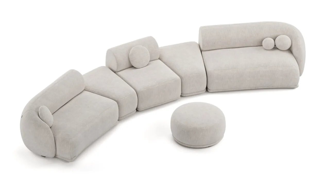 Kreminė Otis modulinė sofa iš viršaus su lenktais segmentais ir atskiru apvaliu pufu.