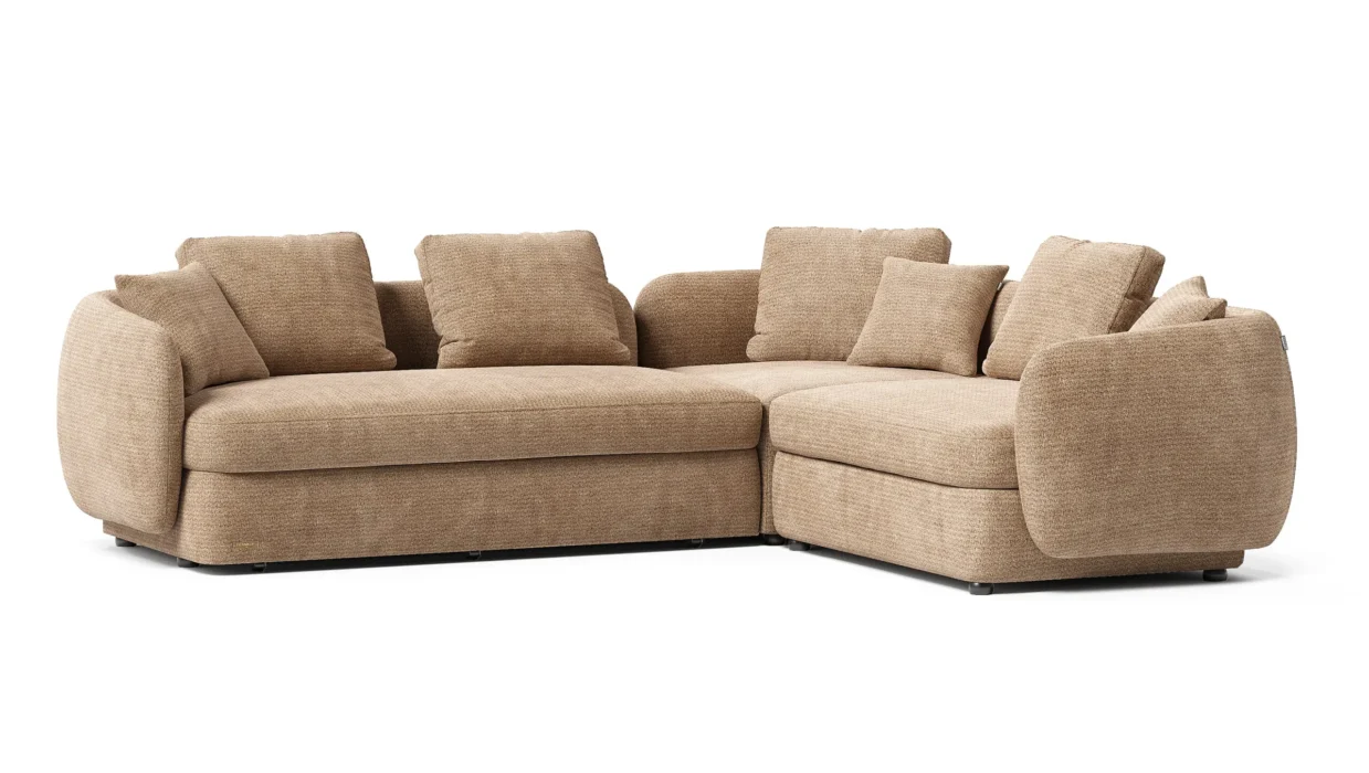 Milton kampinė sofa su plačiu šezlongu ir žemu tekstiliniu profiliu.