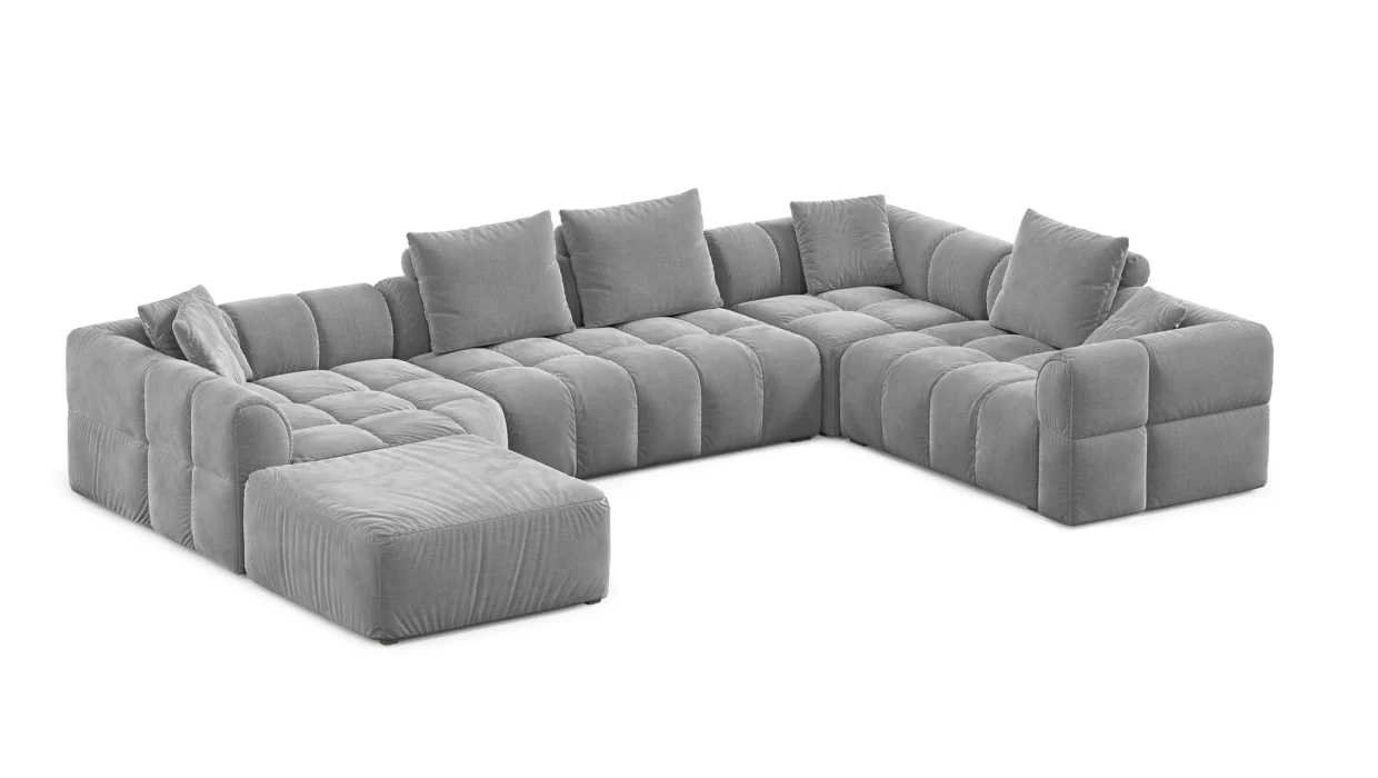 Dakar XL sofa lova su minkštomis pagalvėmis ir plačiu tekstiliniu korpusu.